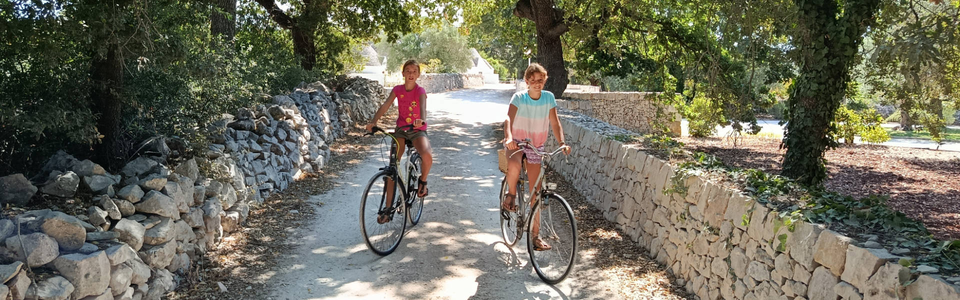 Children cycling in Alberobello